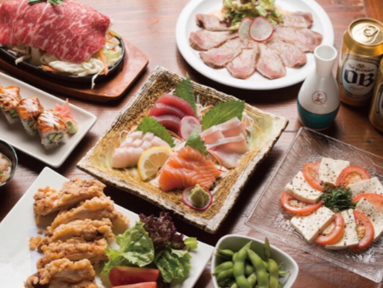 Daruma table spread with sashimi, fried dishes, drinks, and small plates
